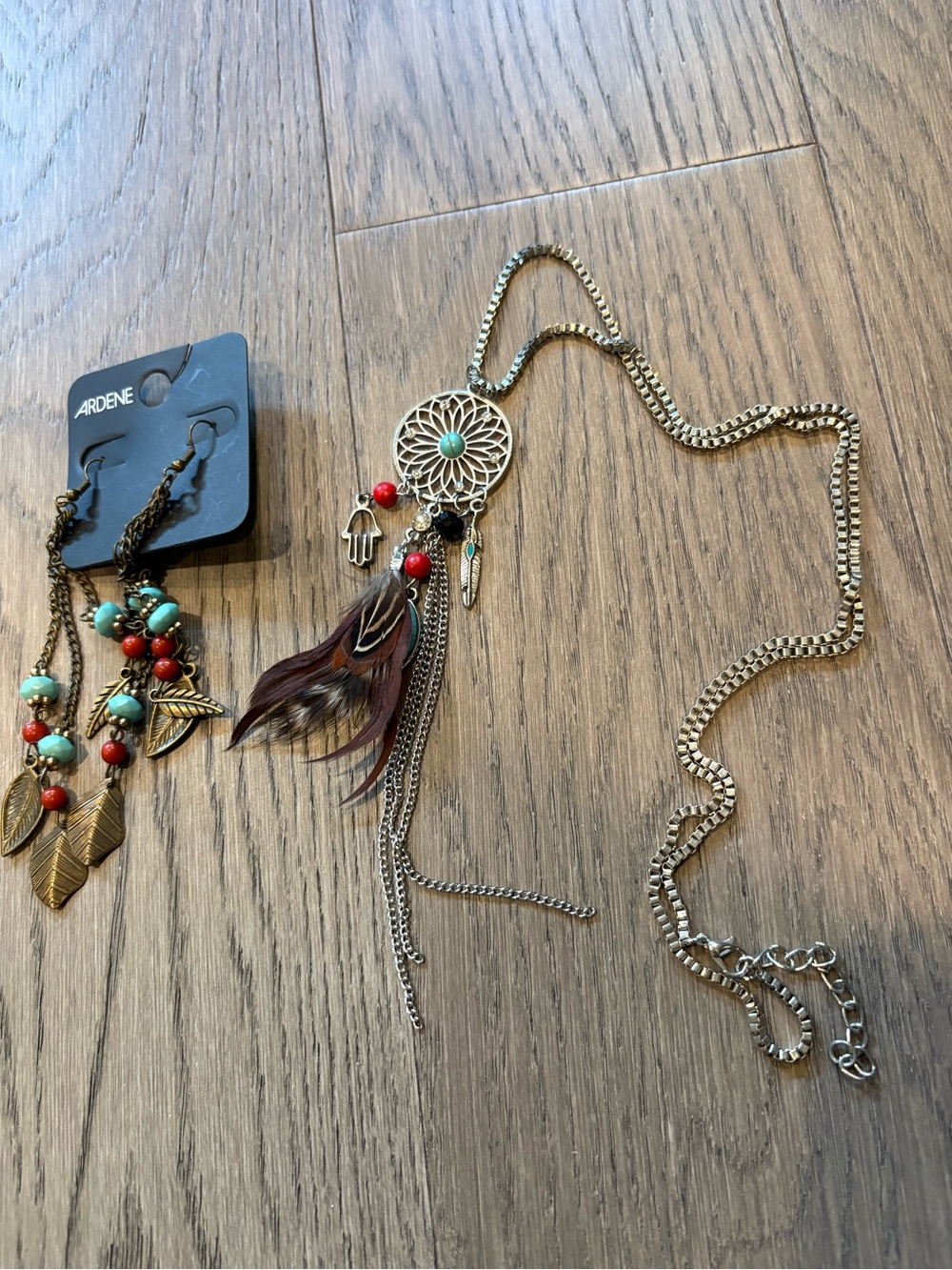 Dreamcatcher Necklace with Red & Turquoise Accents and drop earrings from Ardene